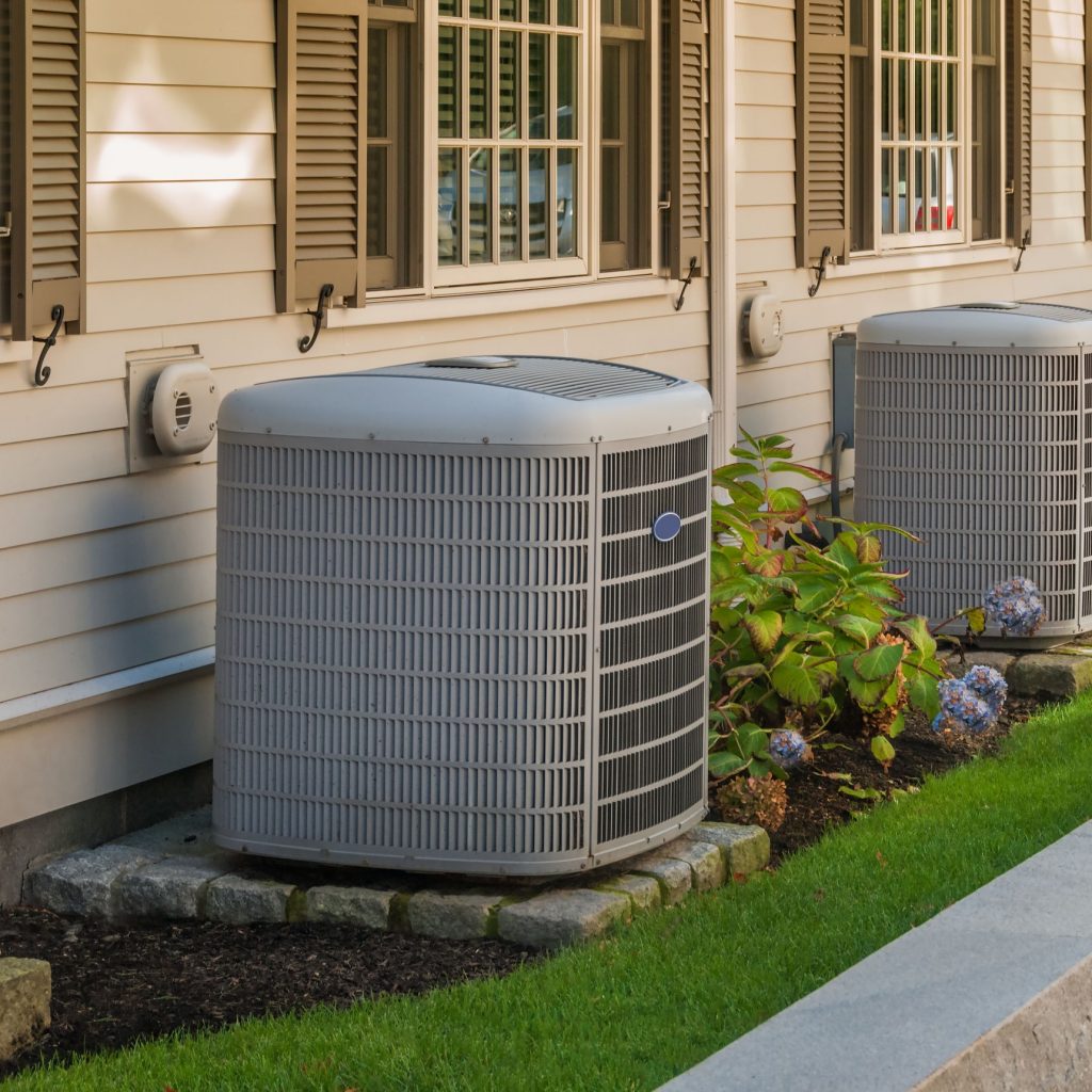 old air conditioner system outside home